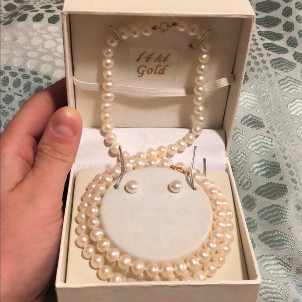 Genuine fw ivory pearls with 14k gold clasps